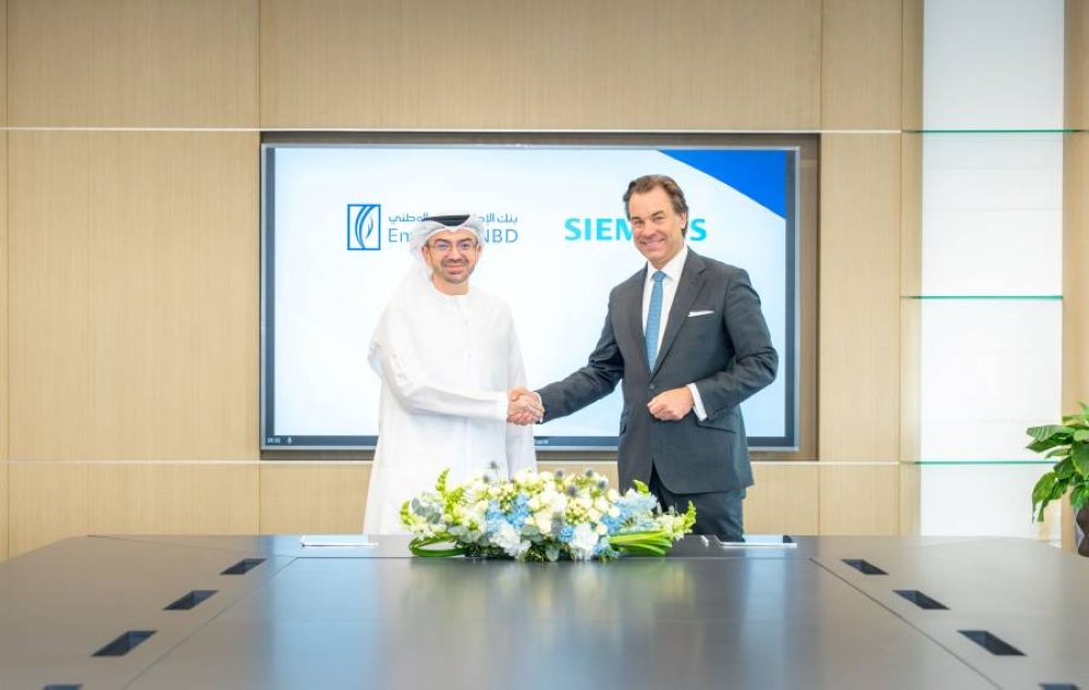 اتفاقية استراتيجية بين بنك الإمارات دبي الوطني و&laquo;سيمنز&raquo; لدعم مشاريع البنية التحتية الخضراء